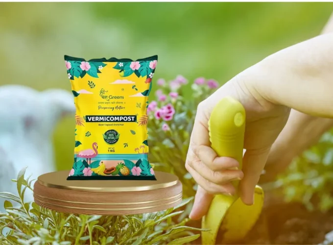 Hand using a gardening tool while a vermicompost fertilizer bag is displayed in a lush green garden setting